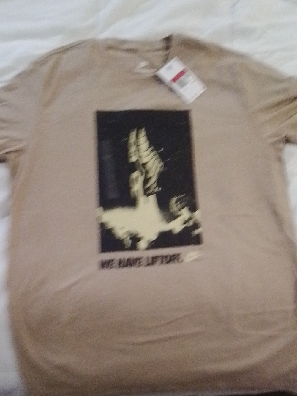 Nike Beige Short Sleeve Graphic Tee with Black & Yellow Print